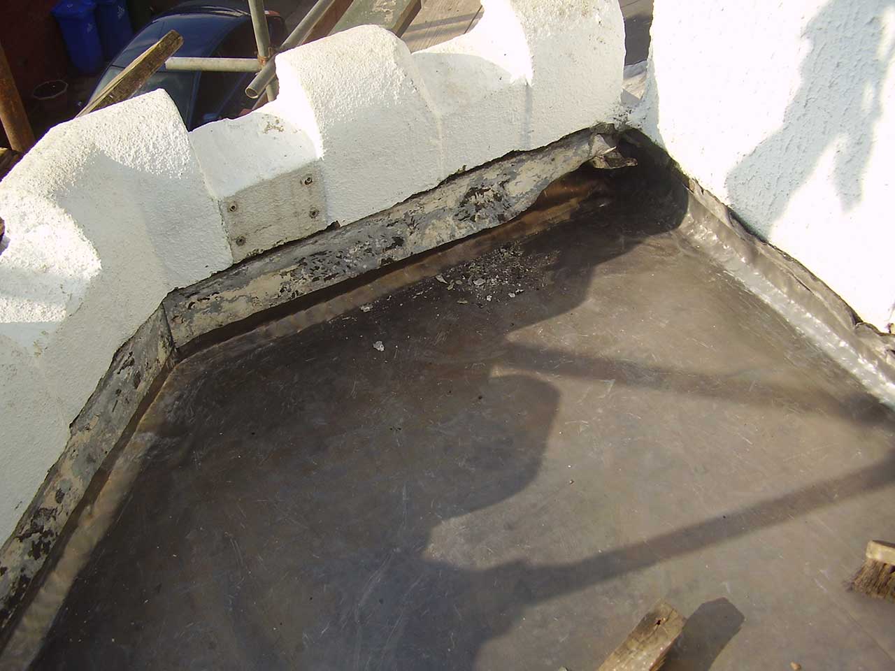 Laying the lead flashing on mock-battlement style flat roof